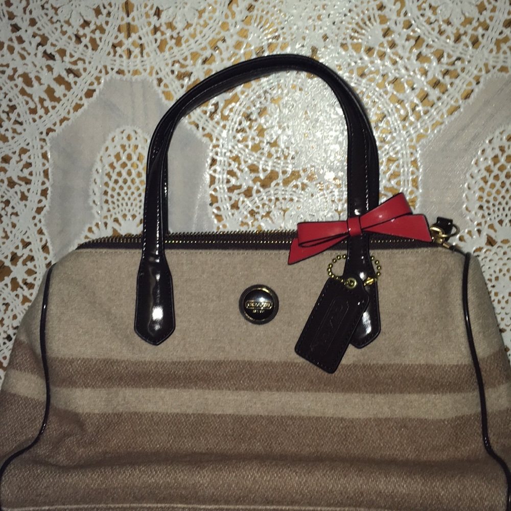 Tan Coach Purse With a Bow